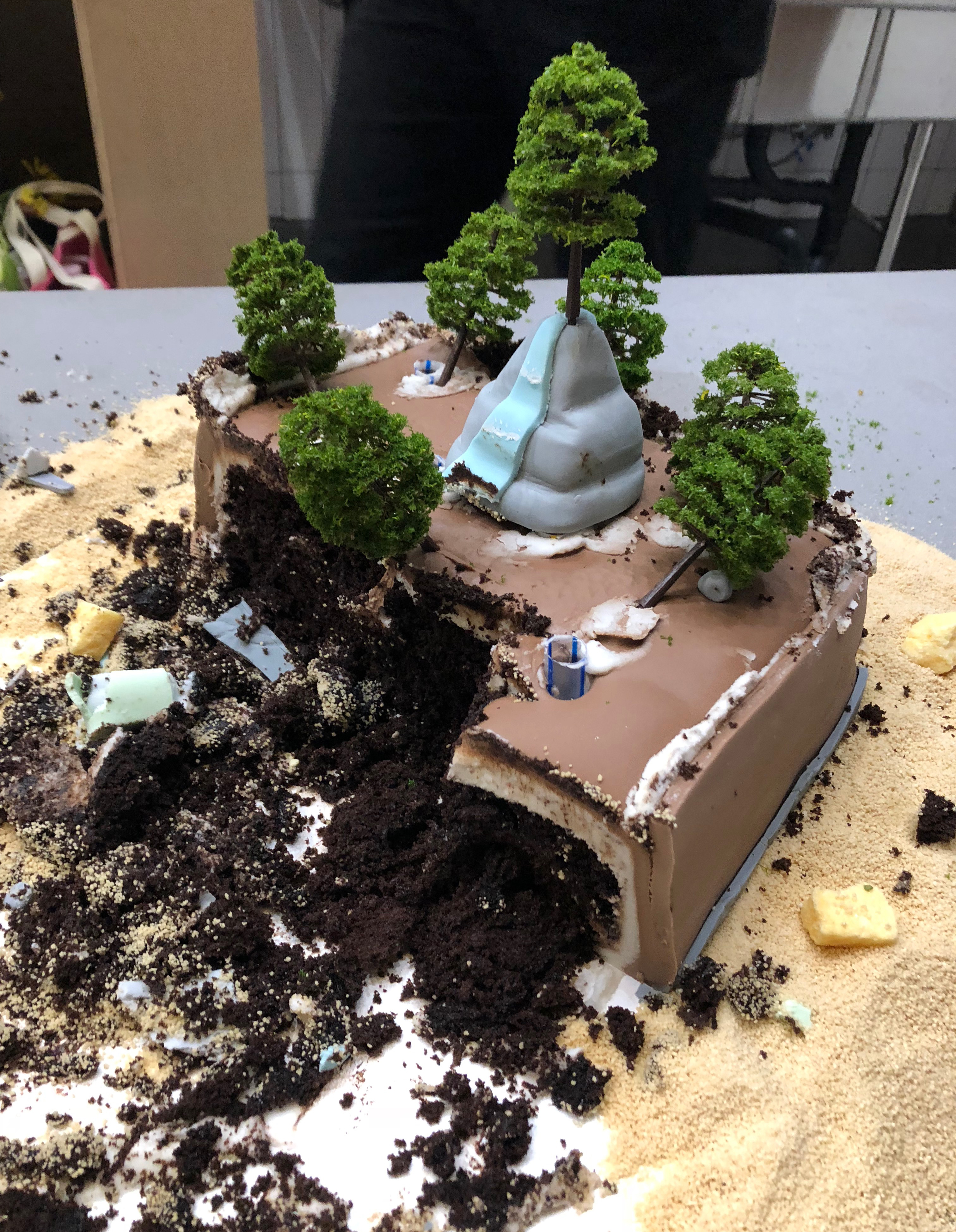 The cake half eaten, its contents spilling out on the countertop